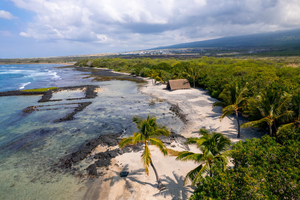 drone photo of honokohau turtle beach at hohokohau harbor