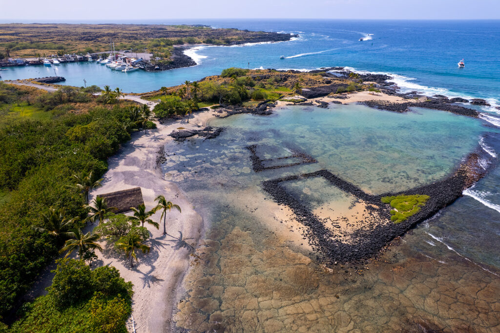 drone photo of honokohau turtle beach bay at hohokohau harbor