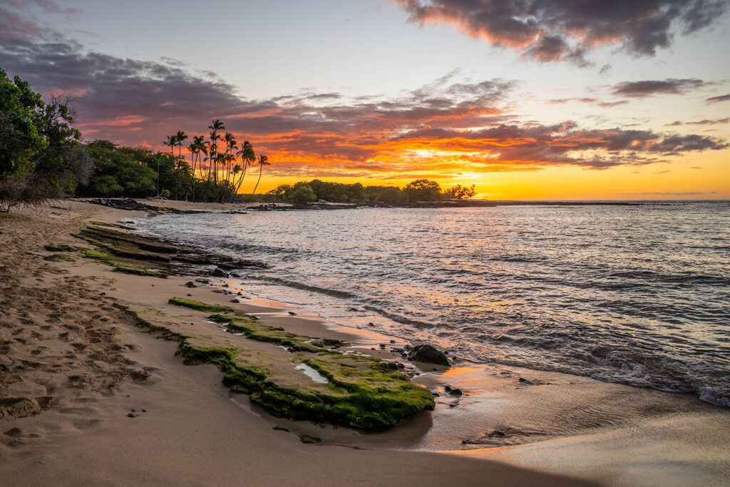 mahaiula beach sunset lava rock coastline palm trees kona big island hawaii