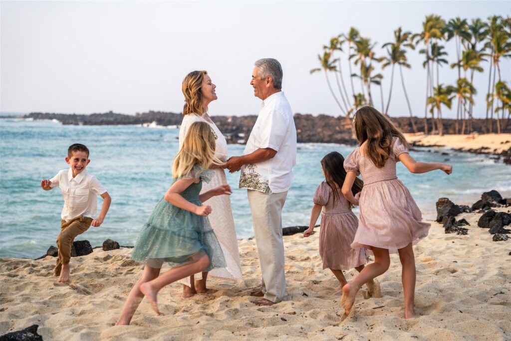 fun family vacation photo ideas playing tag on the beach