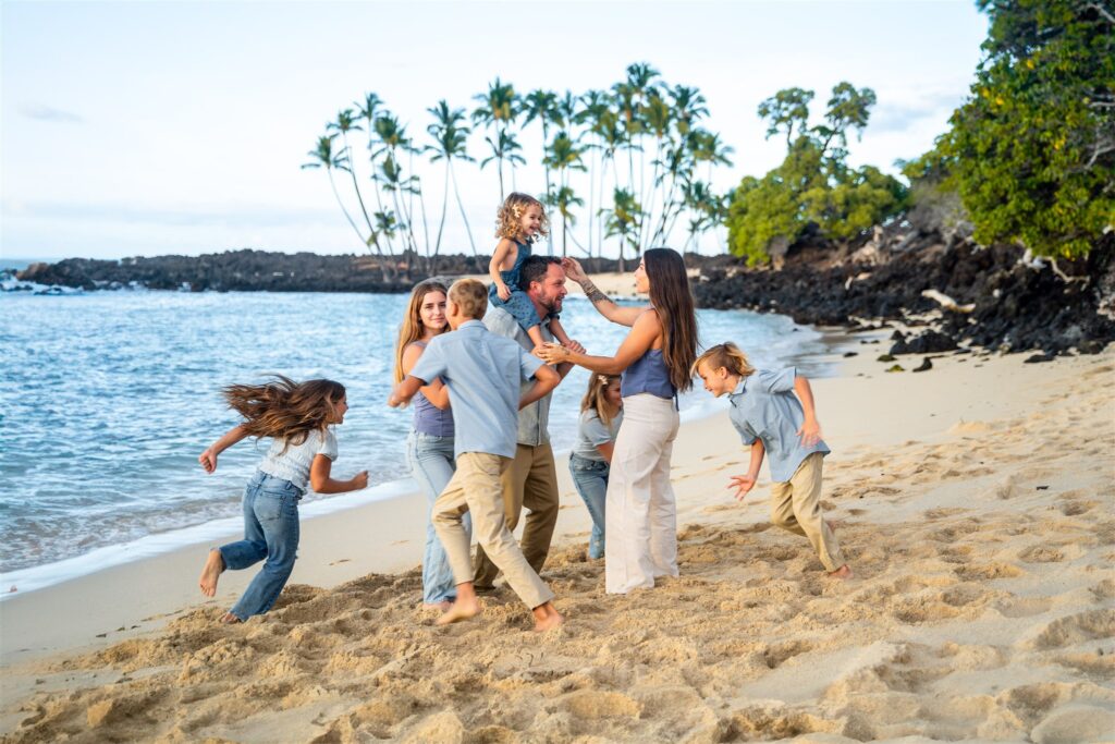 hawaii beach family photo ideas with kids circling around parents