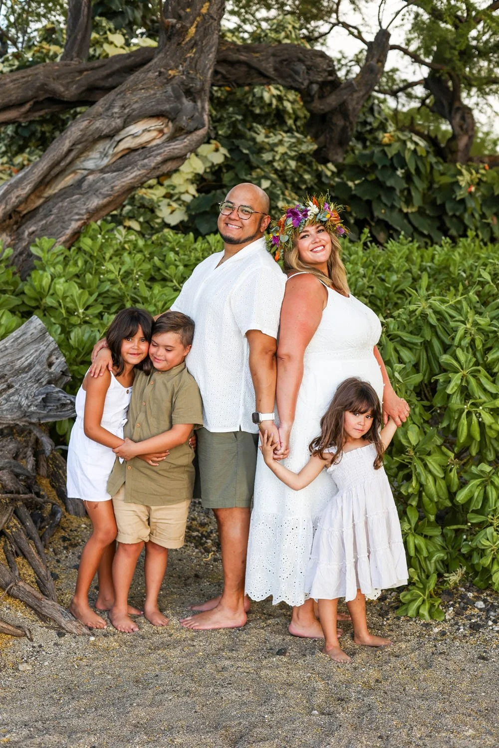 family portrait session on a white sandy beach on the big island of hawaii