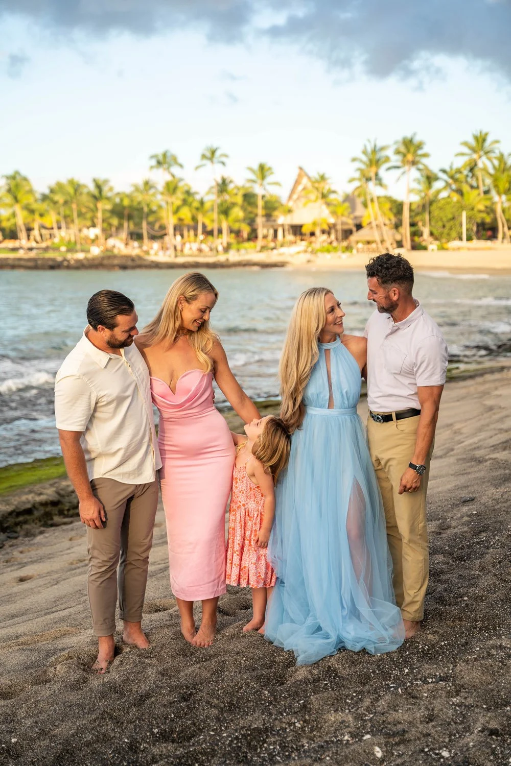 family and friends portrait session at the kona village at a white sandy beach on the big island of hawaii