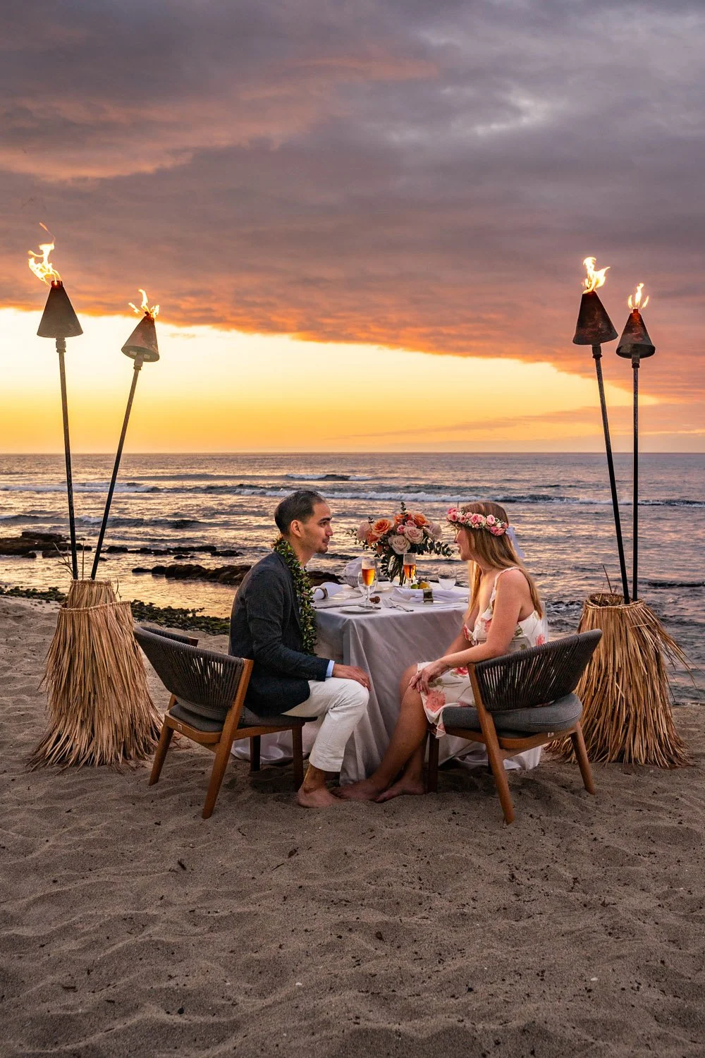 couple having intimate dinner under the stars four seasons hualalai big island