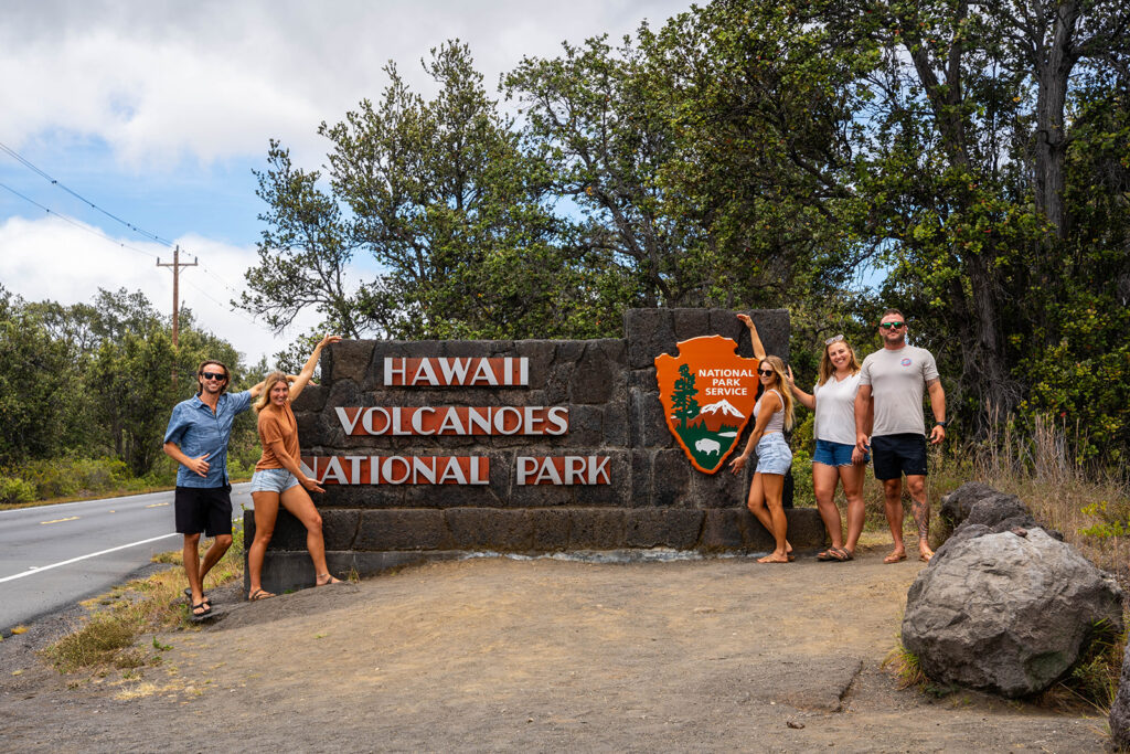 hawaii volcanoes national park entrance sign group of tourists