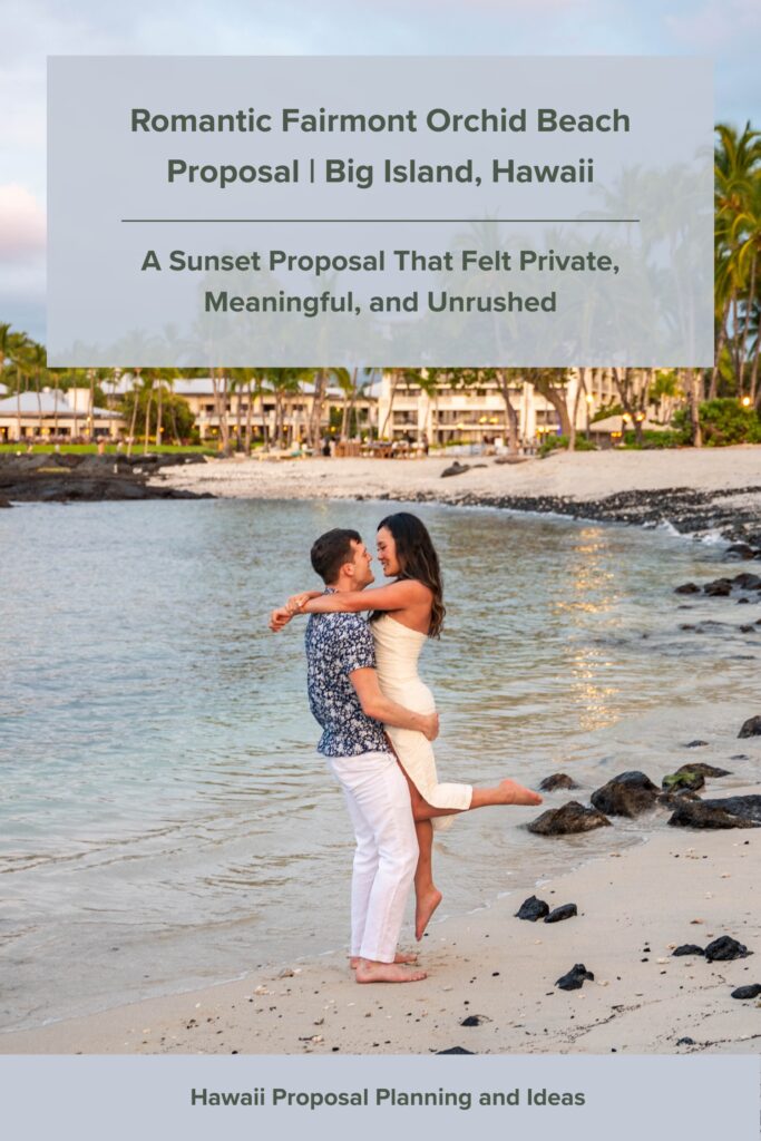 A man lifts a woman in his arms as they smile on a sandy beach at sunset, with palm trees, ocean waves, and a resort in the background. Text overlay highlights their romantic Fairmont Orchid proposal in Hawaii.
