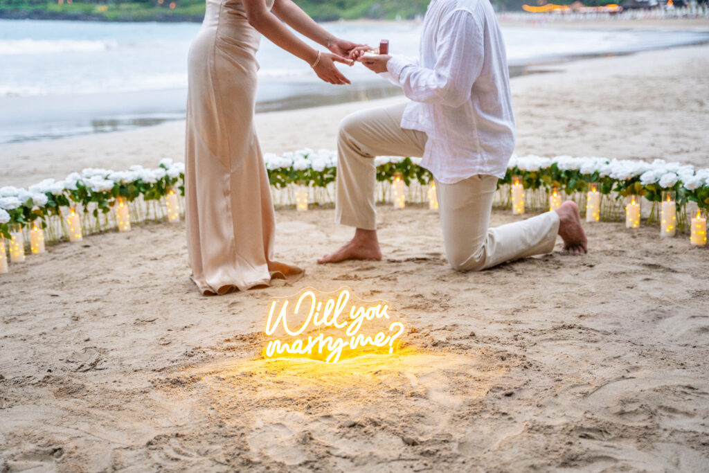 hawaii proposal planning and packages with will you marry me sign