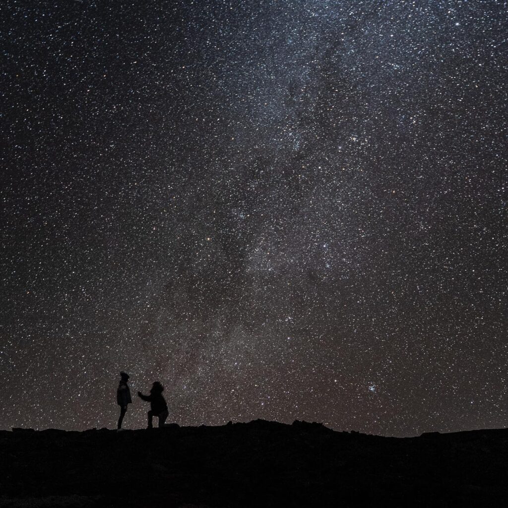 man proposing under big island milky way stars with epic tours hawaii
