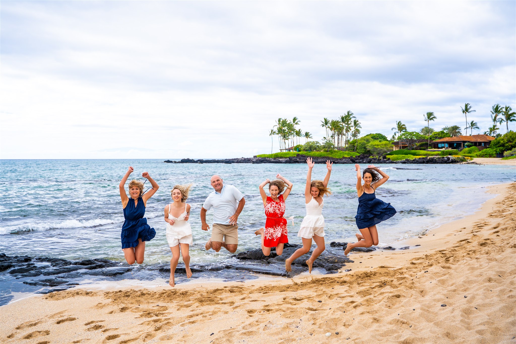 hawaii family photos with teenage kids jumping
