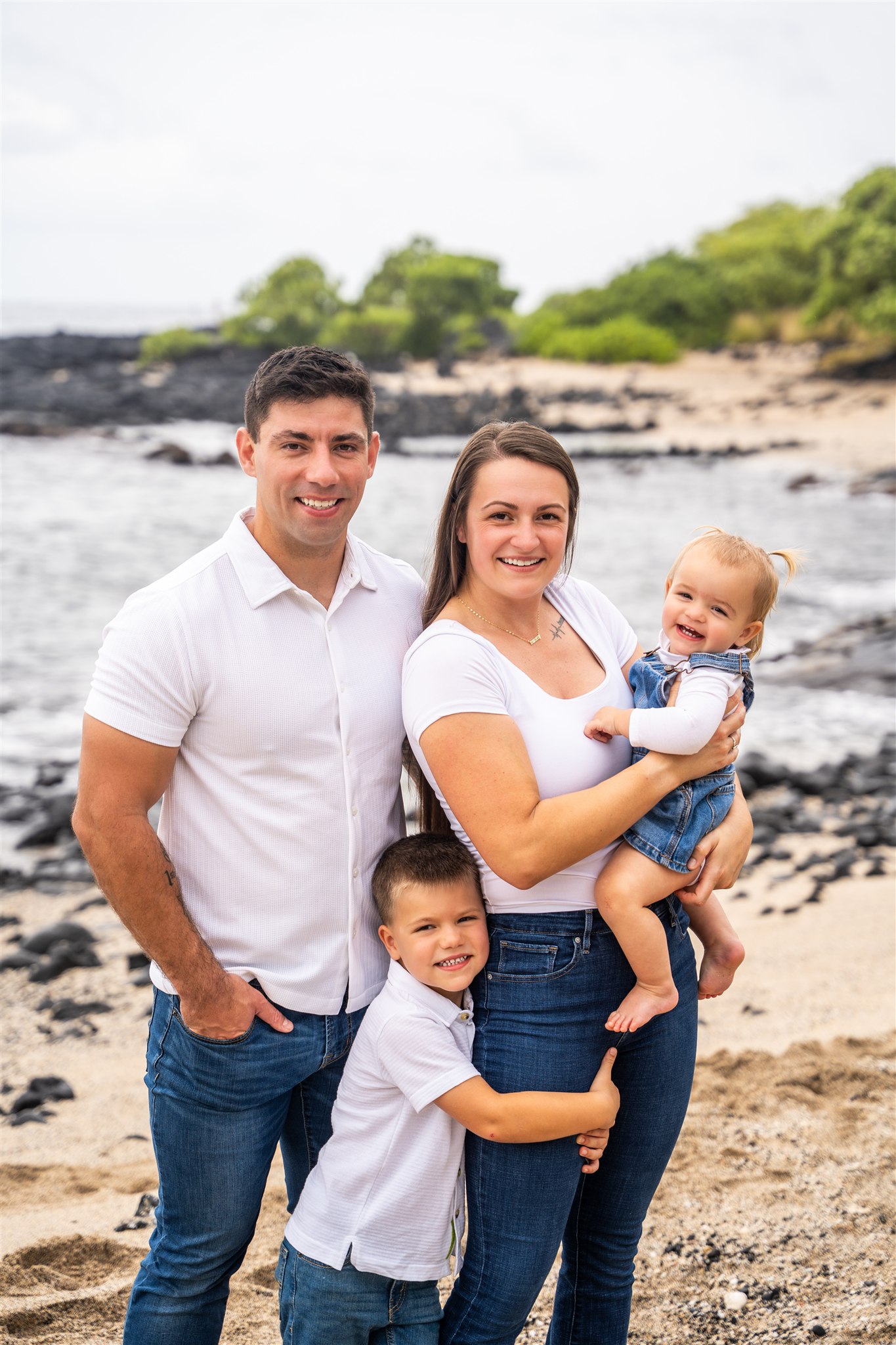 hawaii family photos with everyone looking at the photographer