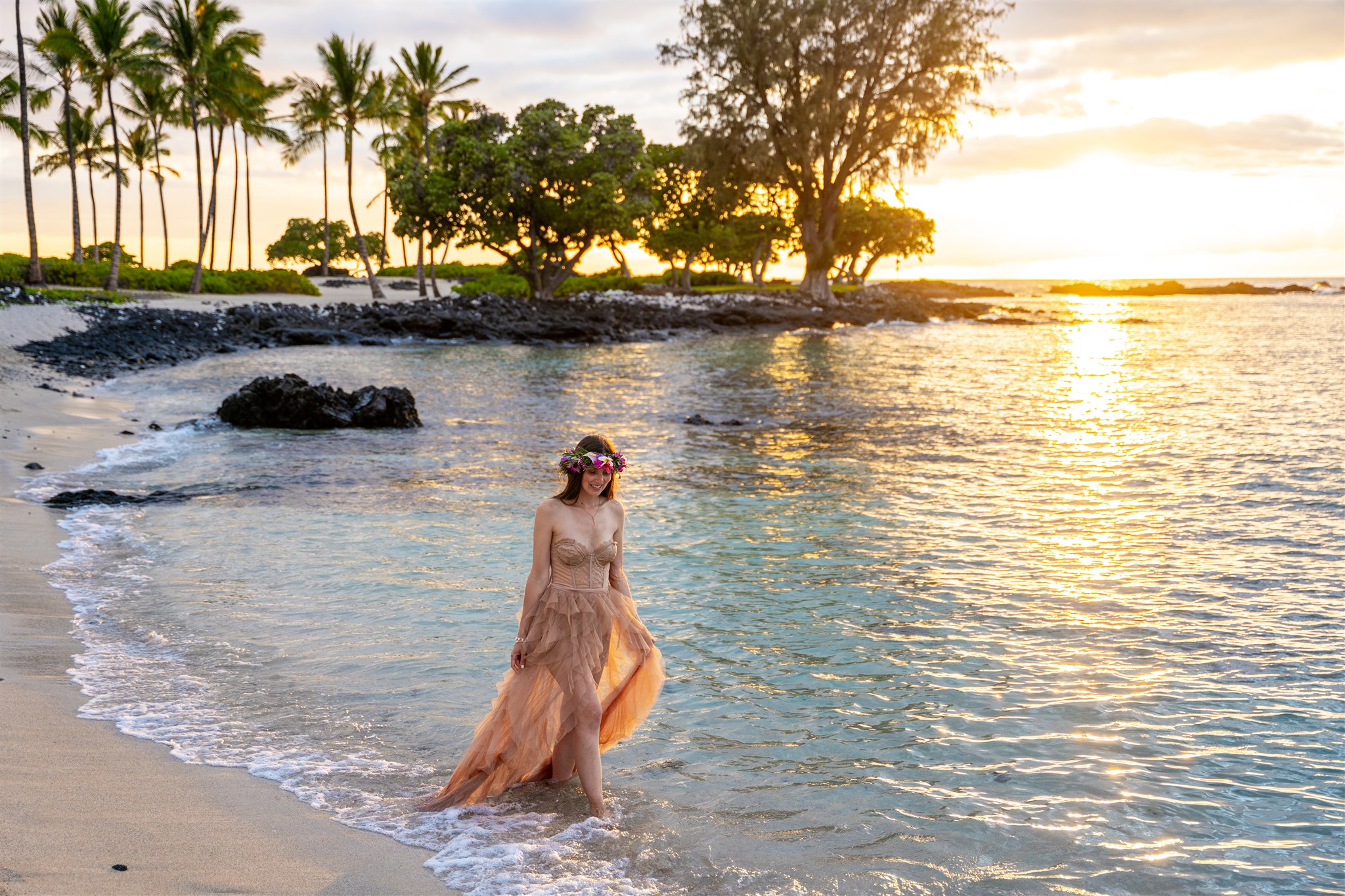 women wearing long dress in ocean hawaii engagement photos