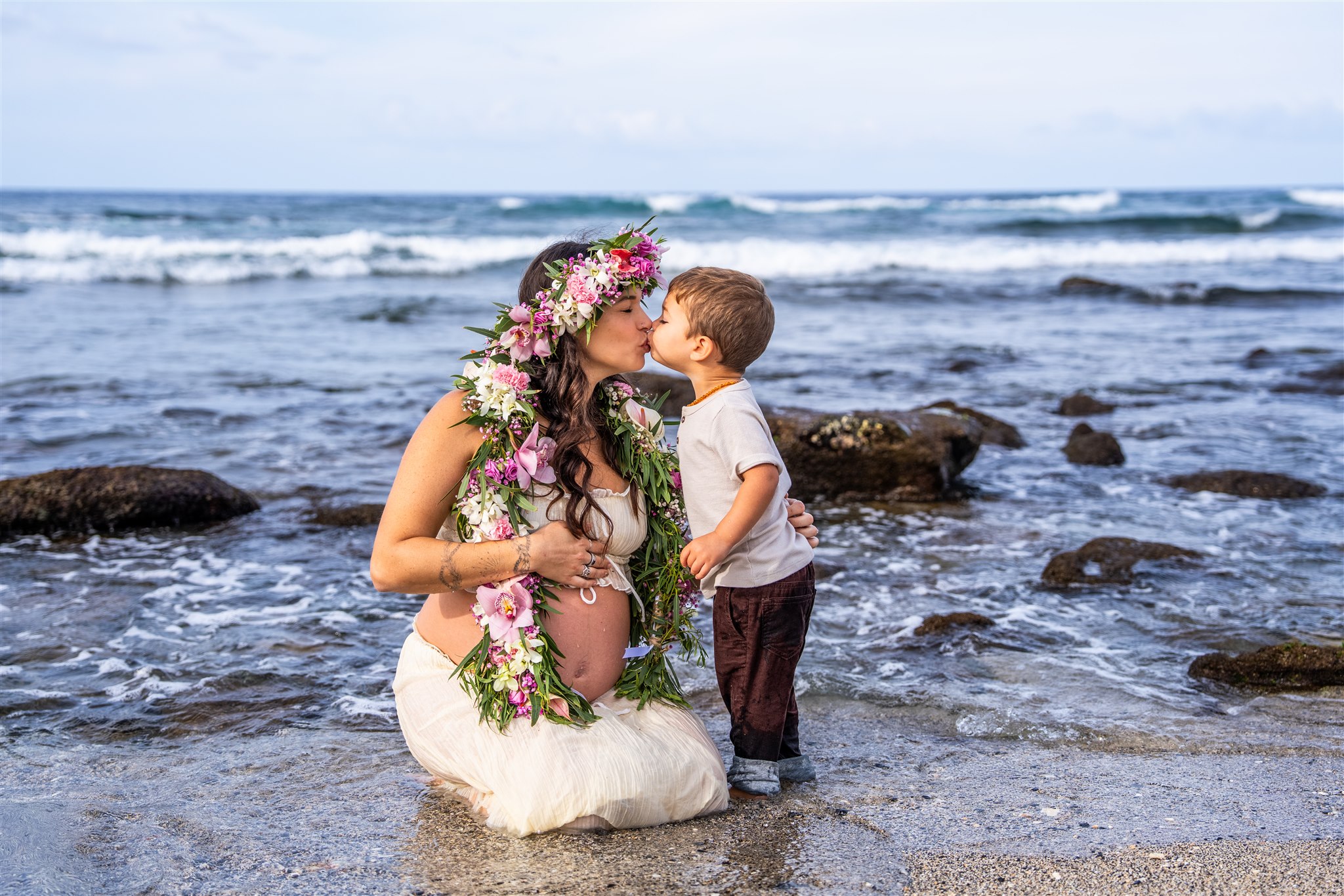 Kona Photos Hawaii of a mom kissing her son