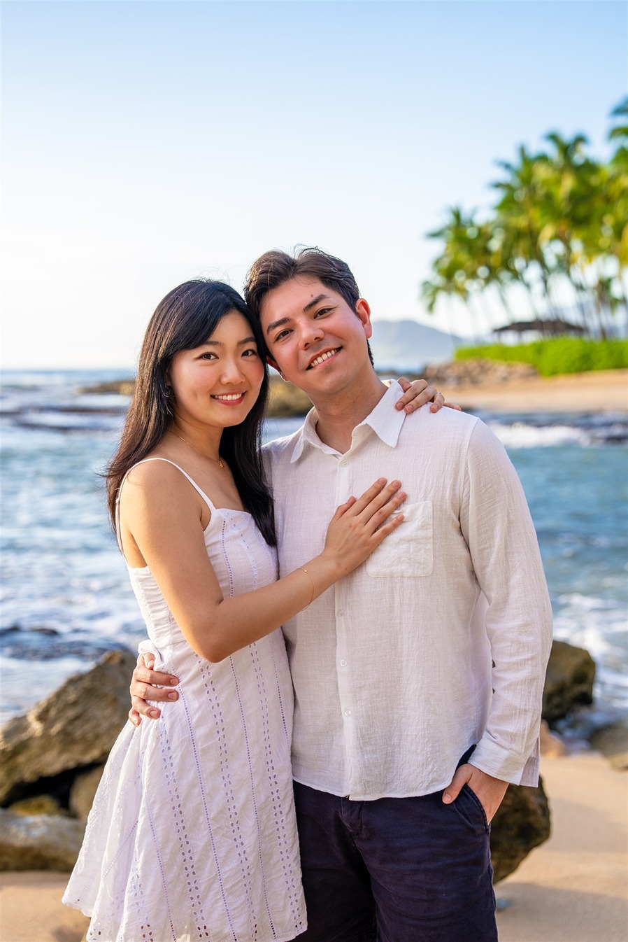 a couple taking their engagement photos in hawaii