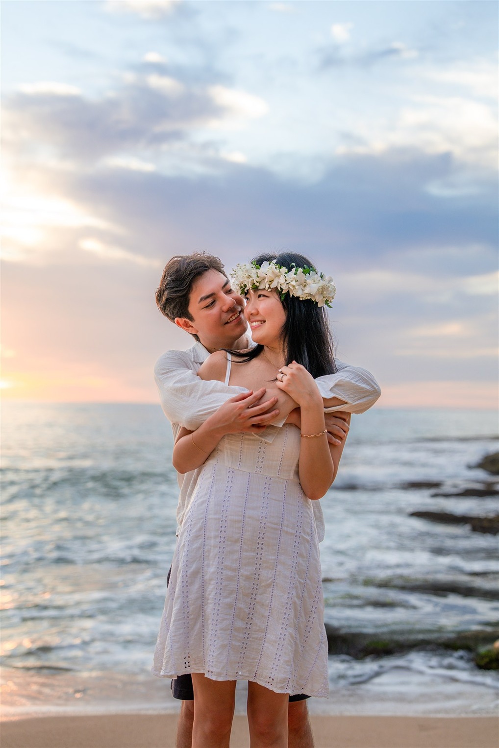 a couple taking their engagement photos in hawaii