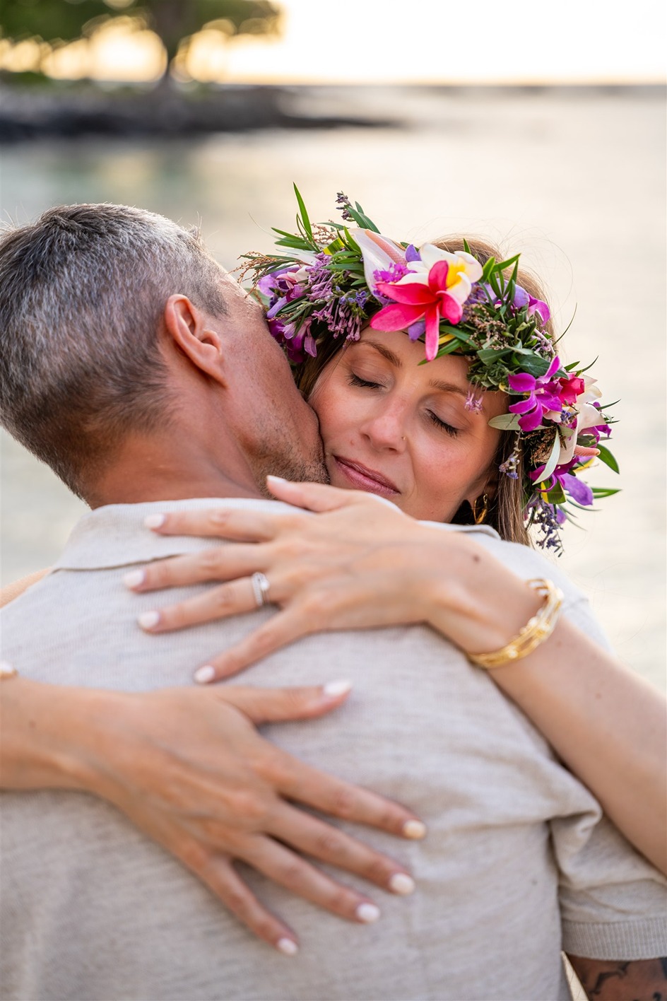 hawaii engagement photos of the couple hugging